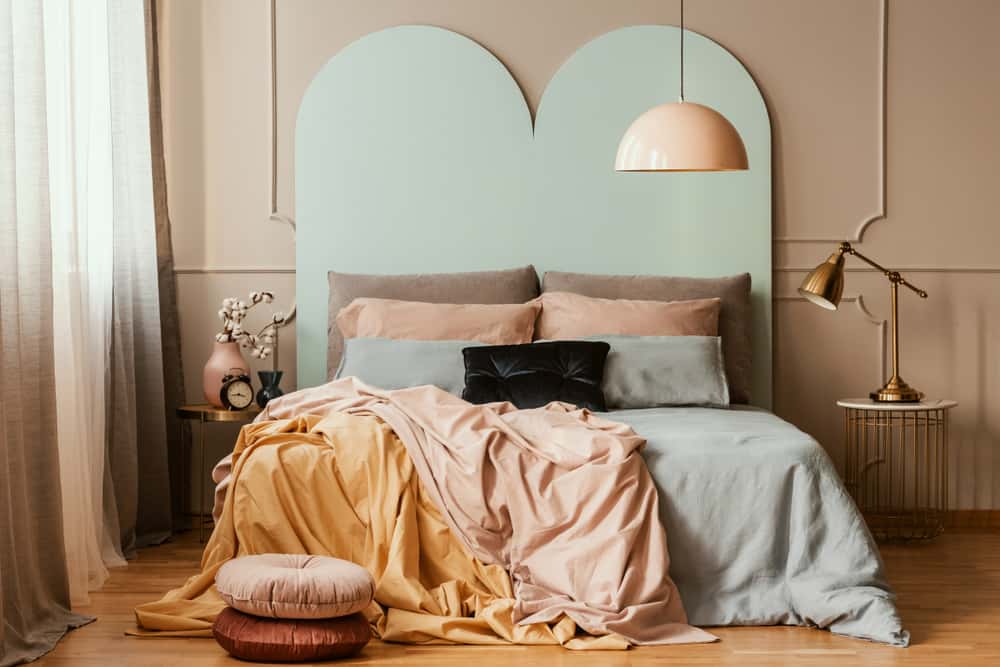 pastel bedroom with dark furniture