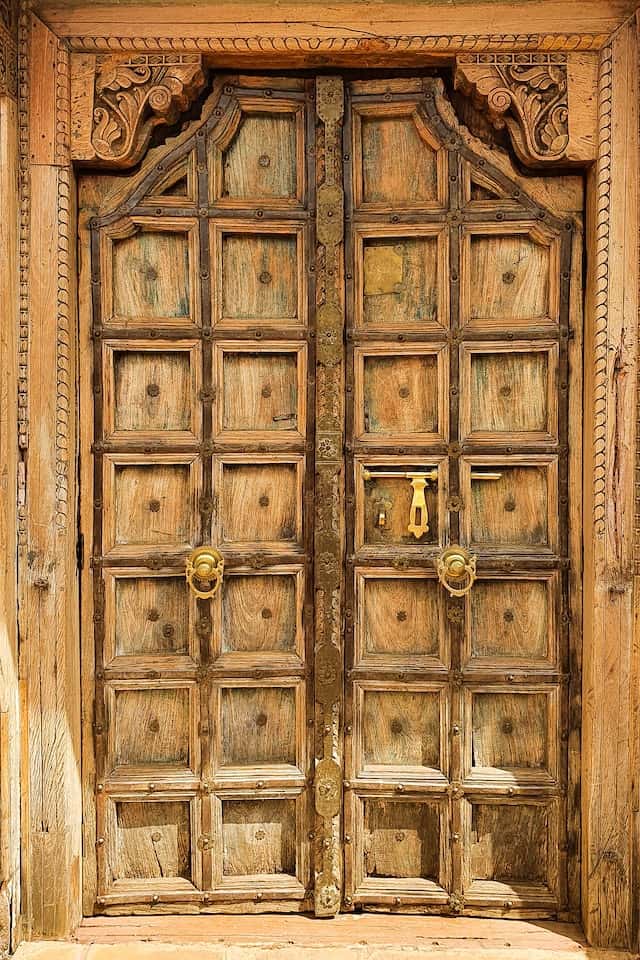 Oval carved wooden front door