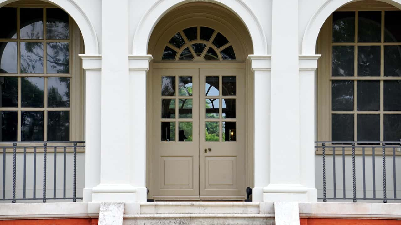 home exterior with arches 